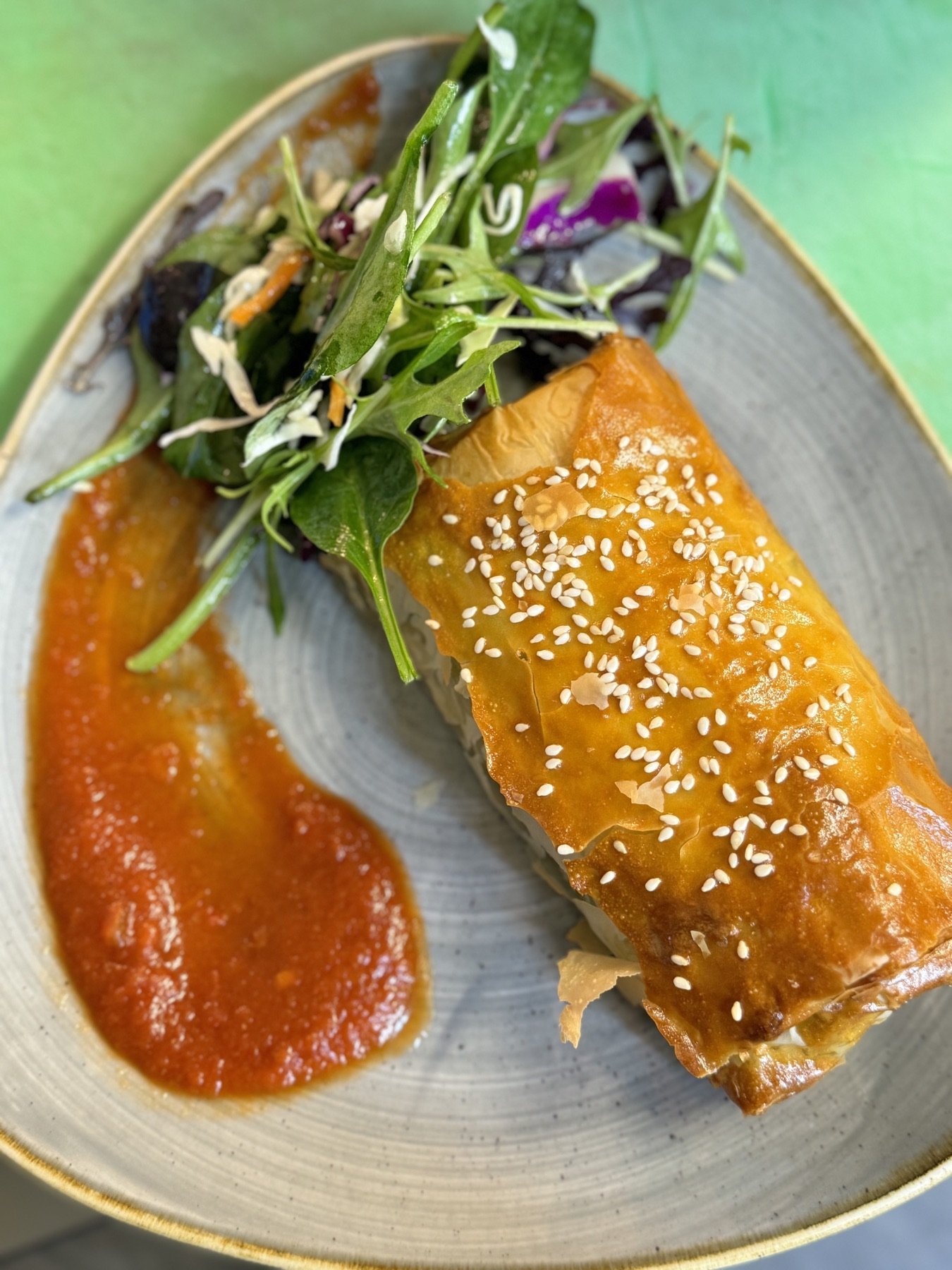 Golden pastry with garden salad